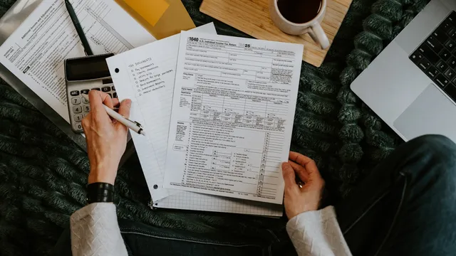 Calculator and paperwork on a desk during a subscription review